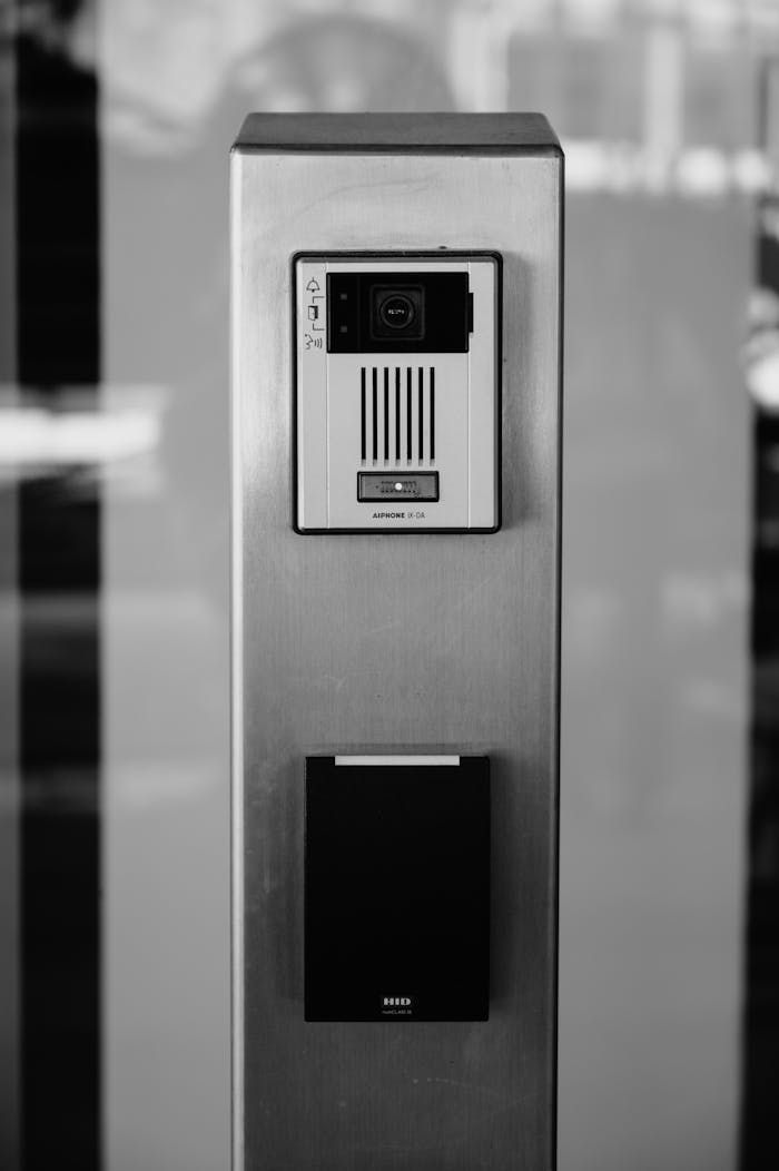 Minimalist black and white photo of an intercom system on a building facade in Boise.